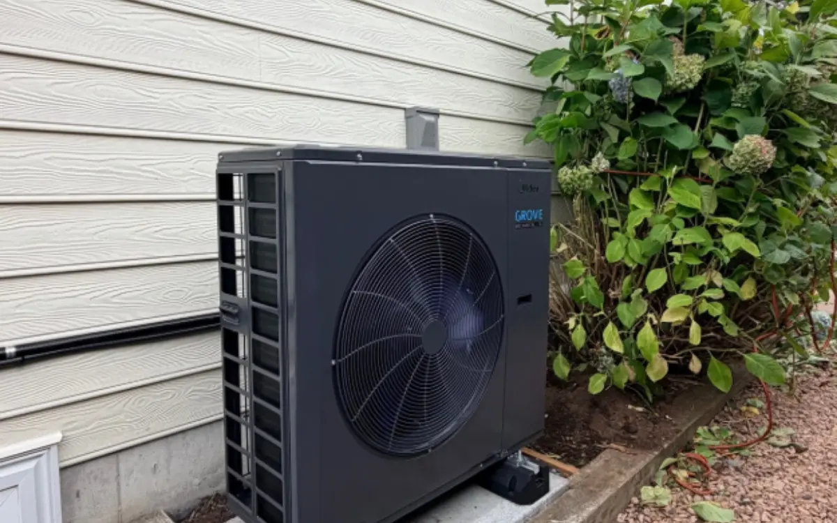 Outdoor heat pump beside a house, a large start-up load for a generator