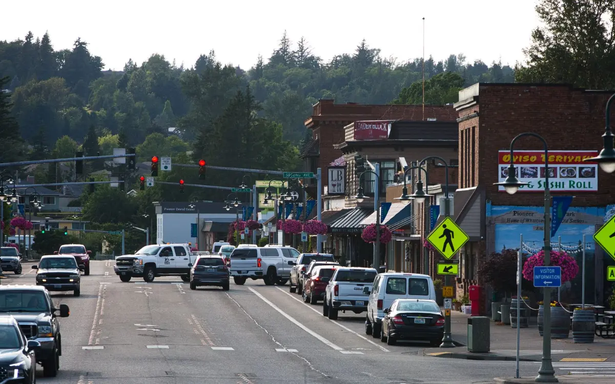 Main street storefronts with the mountains behind, the kind of downtown block we back up